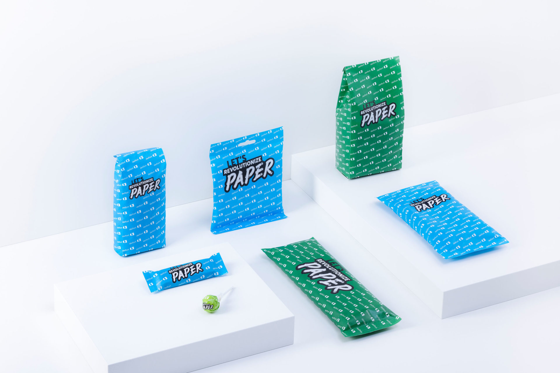 different paper pouches for noodles, rice, sweets, lollies are standing on a table.