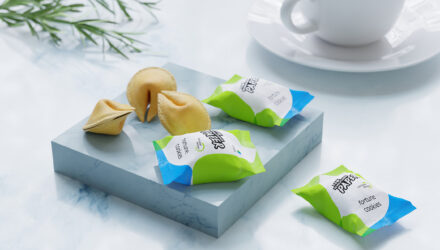 a tablet with fortune cookies. some of them are packed in paper by delfort